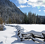 Snow covered meadows, complete with split rail fence in the High Sierra.